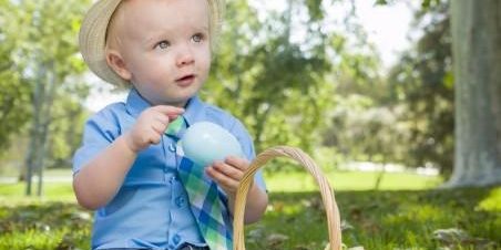 cute-little-boy-enjoying-his-easter-eggs-outside-in-park[1]